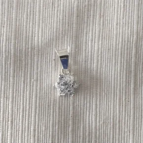Dije plata y piedra